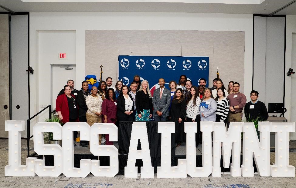 Group of alumni at an alumni event hosted at LSC-CyFair