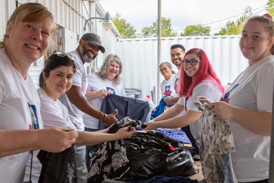 Day of Service Volunteers sorting donations. 