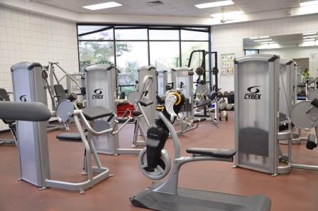 Photo of exercise machines inside weight room
