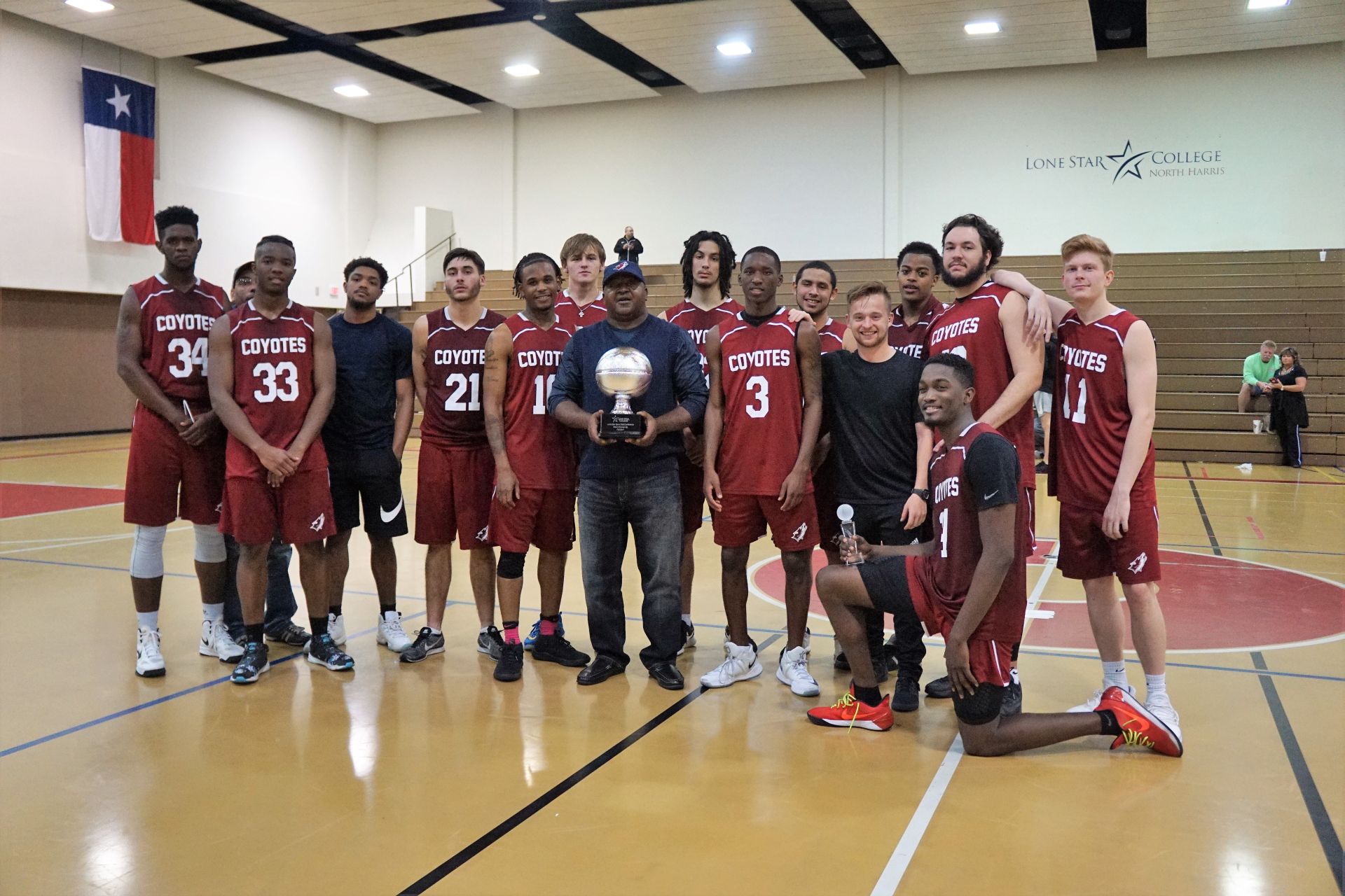 Team photo of student from LSC-Kingwood with a trophy