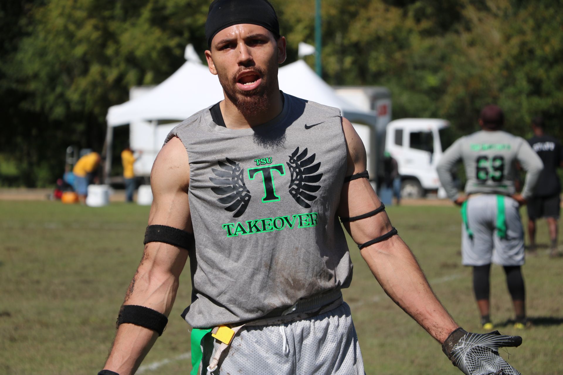 Photo of a student posing for a photo at a flag football tournament