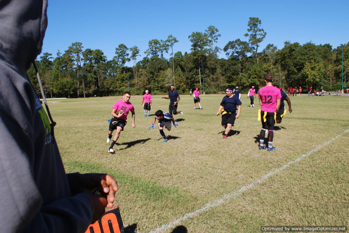 Photo of students playing flag football