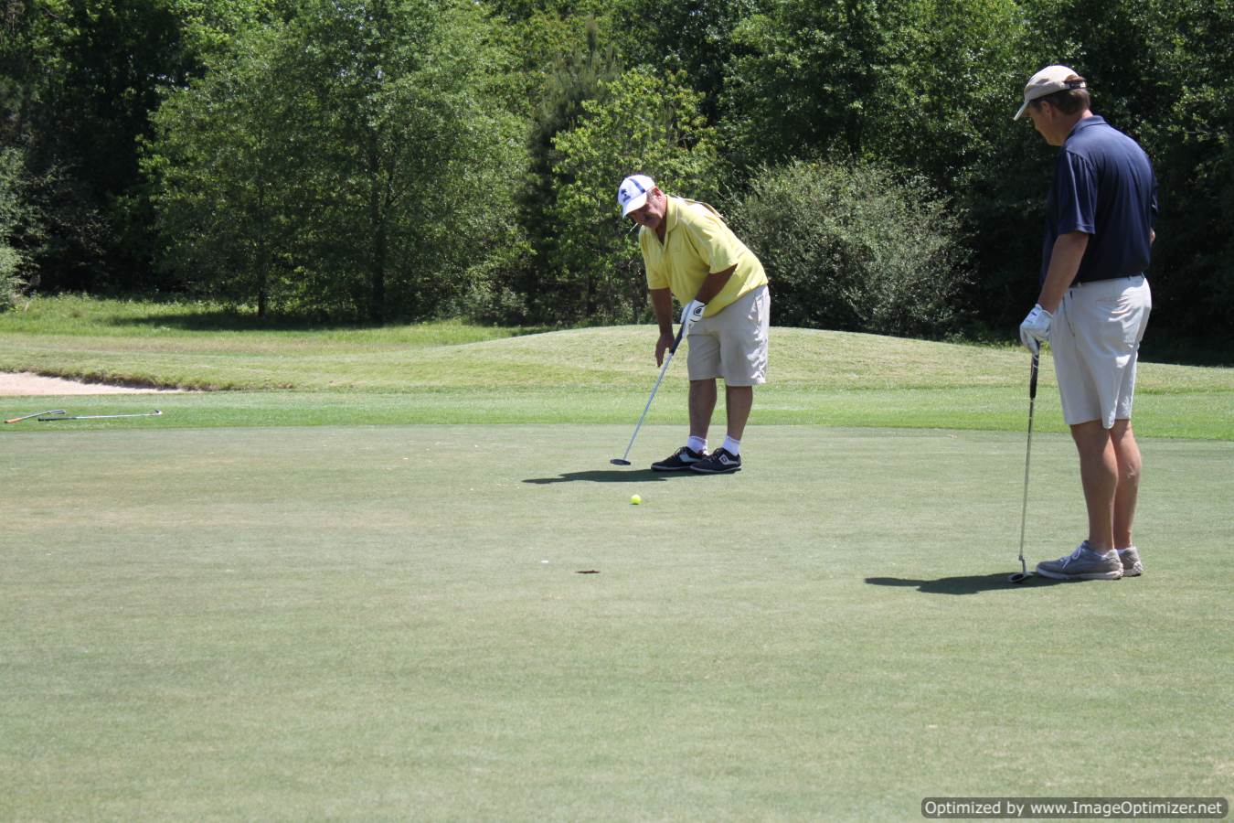 Photo of LSC employees playing golf