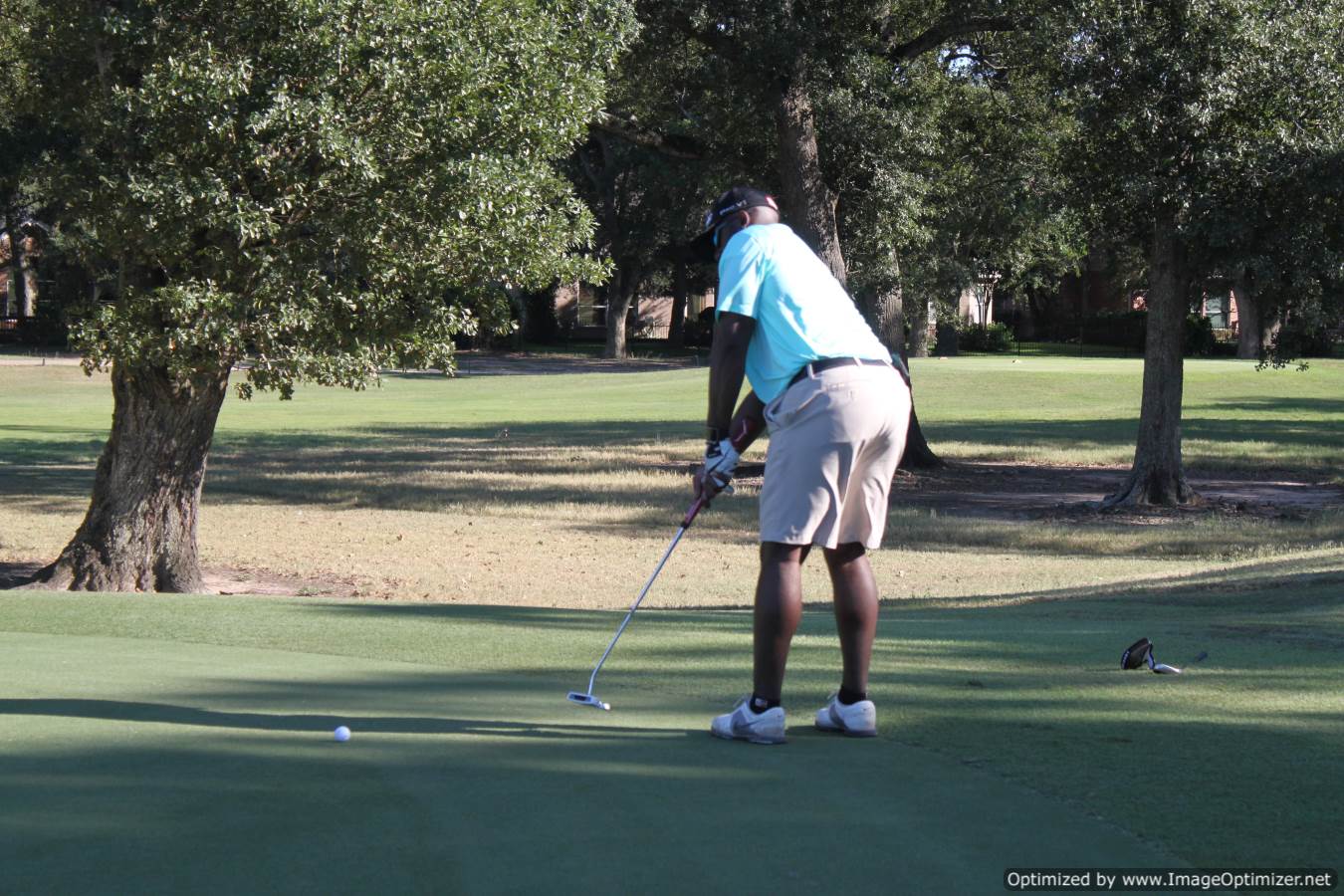 Photo of LSC employee playing golf