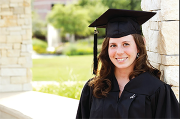 female graduate wearing black cap and gown