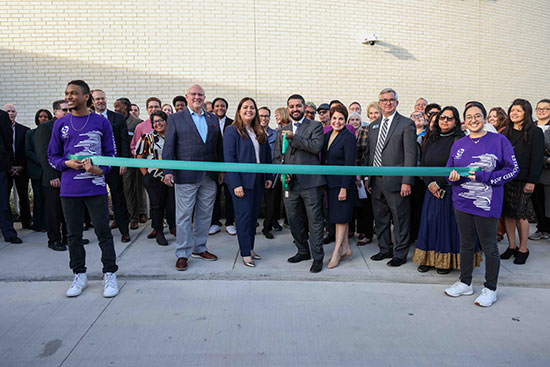 Marking a Milestone: Lone Star College Chancellor Mario K. Castillo (center) prepares to cut the ceremonial ribbon at the grand opening of LSC-University Park's Visual and Performing Arts Center. 