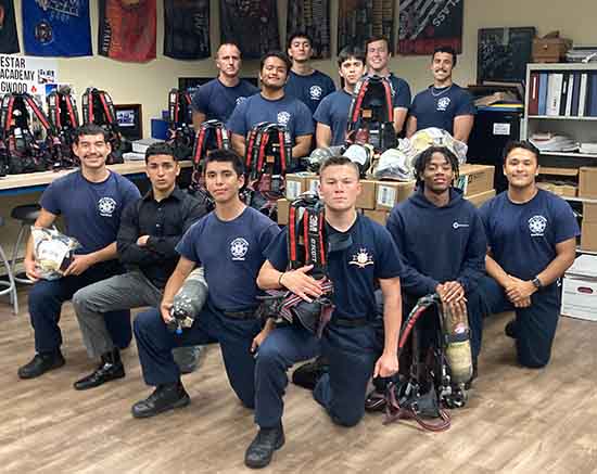 Photo of Fire Science students holding equipment