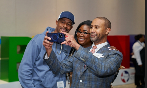 Dr. Bennie Lambert taking a selfie with LSCS Alumni Council member Angel Jameson and her husband.