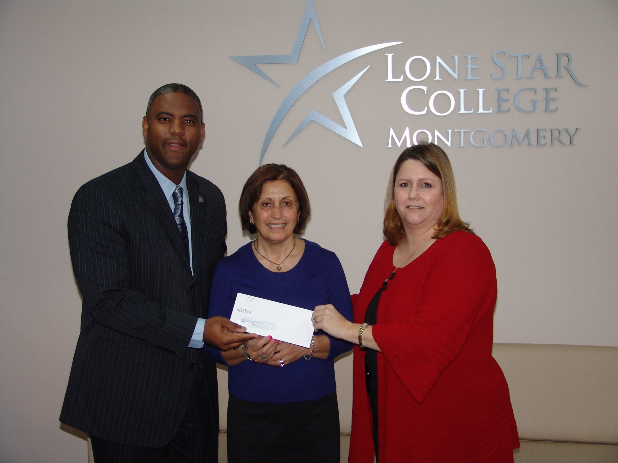 Officials from Memorial Hermann The Woodlands Hospital recently presented a check to the Lone Star College-Montgomery nursing program in order to fund a faculty position. The new position will allow the college's nursing program to continue to expand, meeting the critical need for nurses in the area. Pictured (l. to r.) are Dr. Austin A. Lane, president of LSC-Montgomery, Manijeh Azhang Scott, director of the LSC-Montgomery nursing program, and Jacquenette Chambers-McBride, the new interim chief nursing officer at Memorial Hermann The Woodlands.