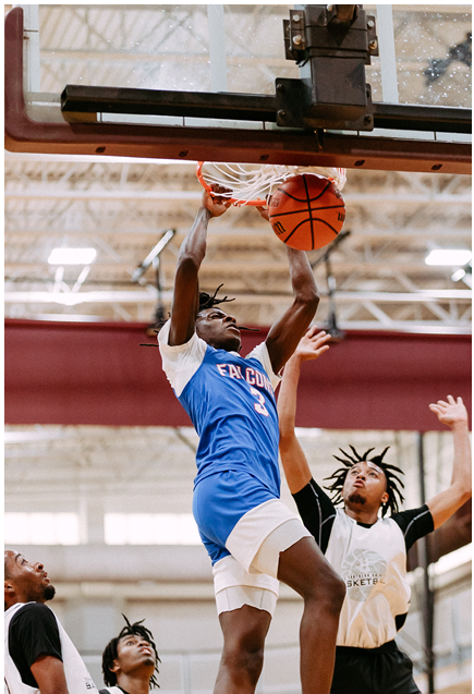 Photo of a LSC-CyFair Men's Basketball player throwing down a two-handed dunk