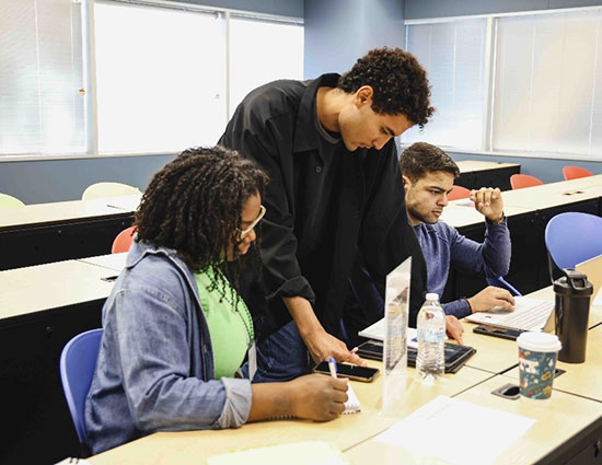 A VITA volunteer assists a student with tax preparation as part of the Lone Star College-University Park Accounting Club's free Volunteer Income Tax Assistance program, available to students, faculty, staff and the local community.