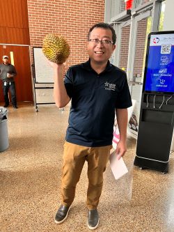 Photo of LSC Professor holding a Chinese fruit
