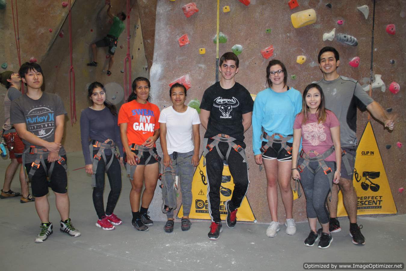 Group photo of students posing for photo at indoor climbing place