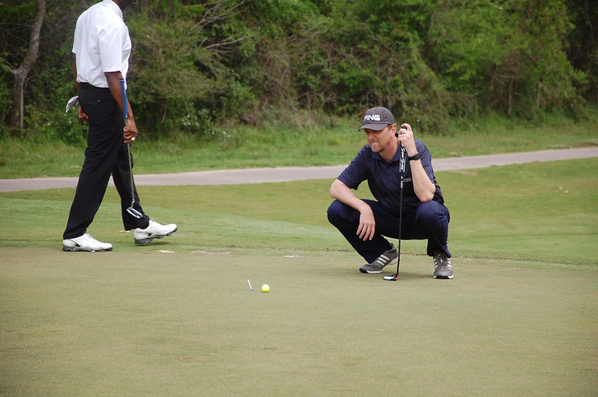 Photo of LSC employees playing golf