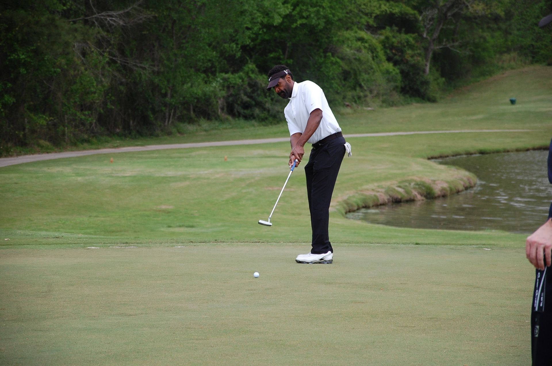 Photo of LSC employee playing golf