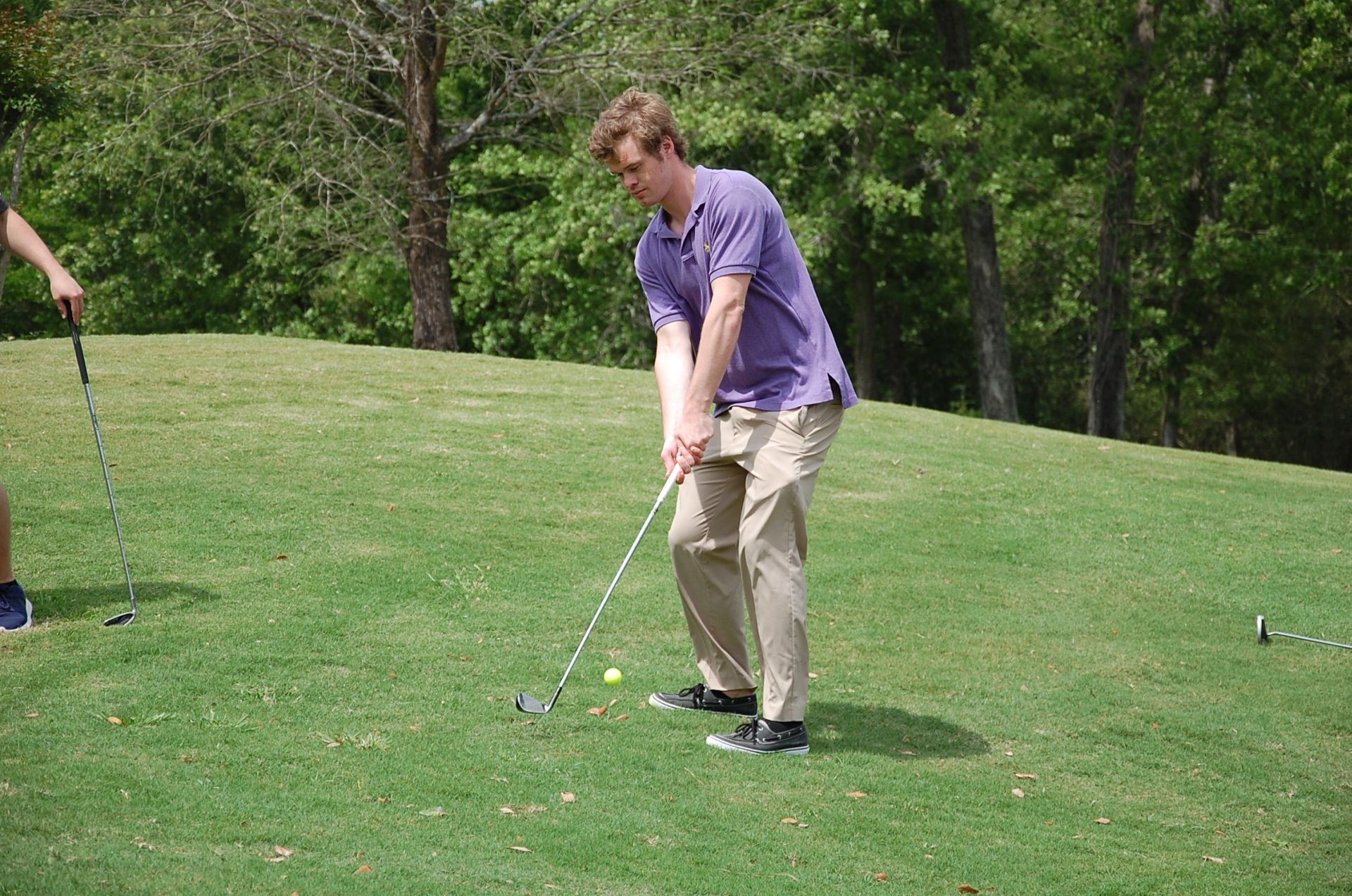 Photo of student playing golf