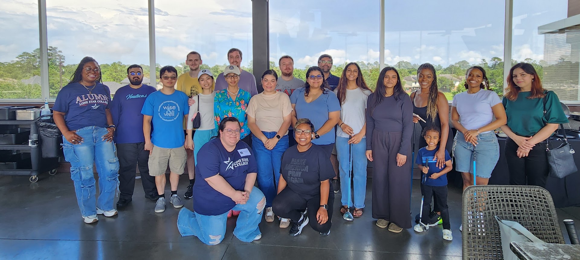 Alumni grouped together at an Alumni Top Golf event