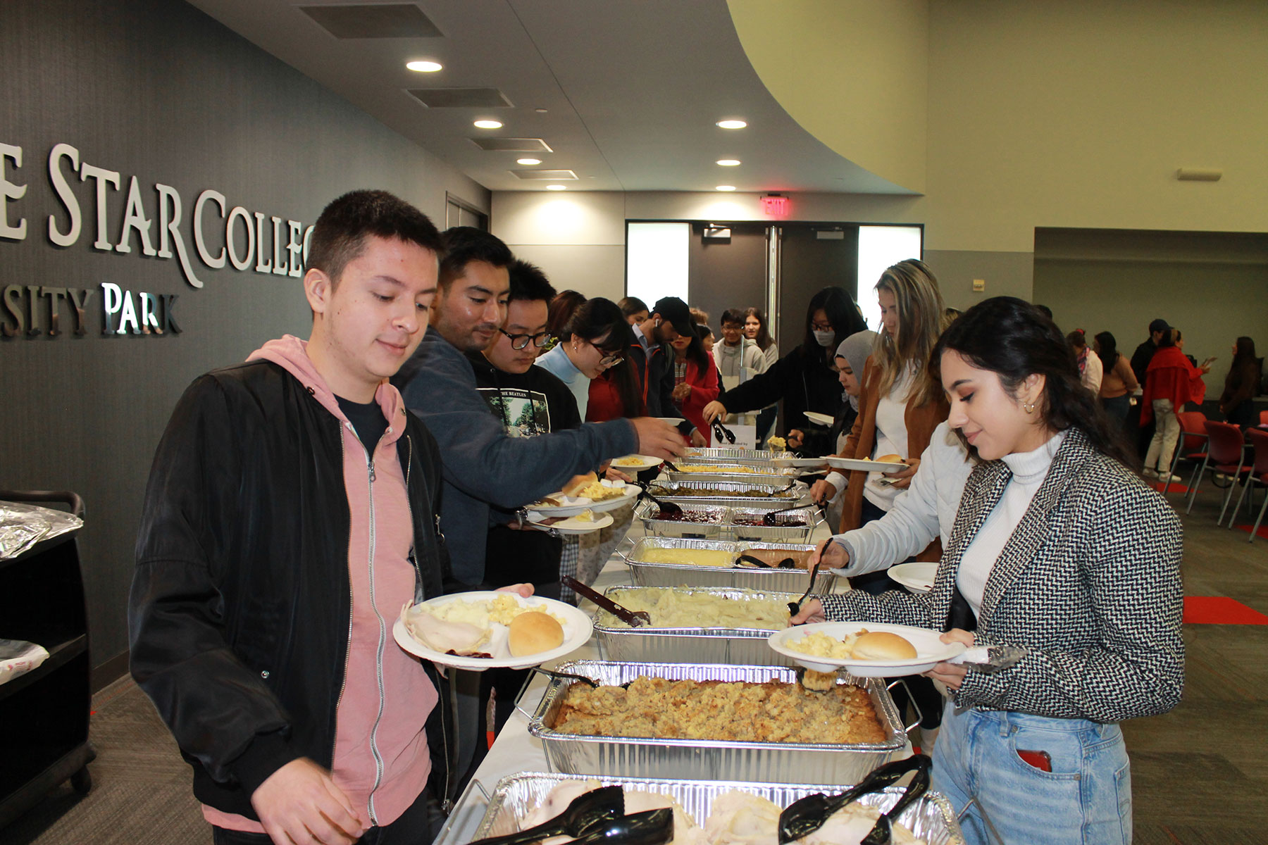 ESOL Students Serving Thanksgiving Food in Buffet Line