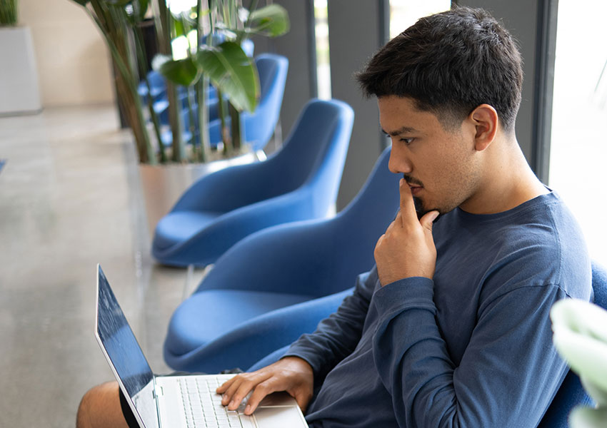 Male student with laptop