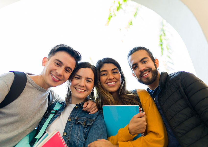 Four Smiling Hispanic Heritage Students