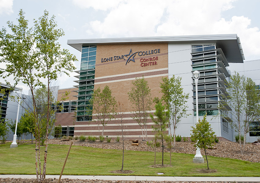 LSC-M conroe center building with lone star logo and trees