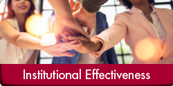 Institutional Effectiveness (Photo of five professionals reaching their hands out to meet together in the middle as a team. "Institutional Effectiveness" appears in a red bar along the bottom of the image.)
