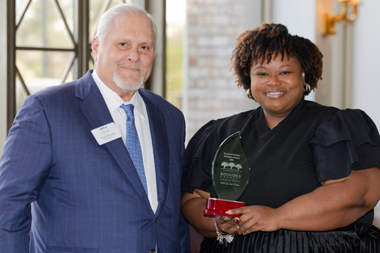 Rosalin Lambey, TRIO SSS, receives Boys and Girls Country Education partner award. 