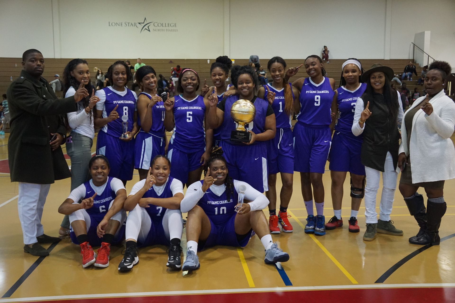 Team photo of students from Prairie View A&M University with a trophy