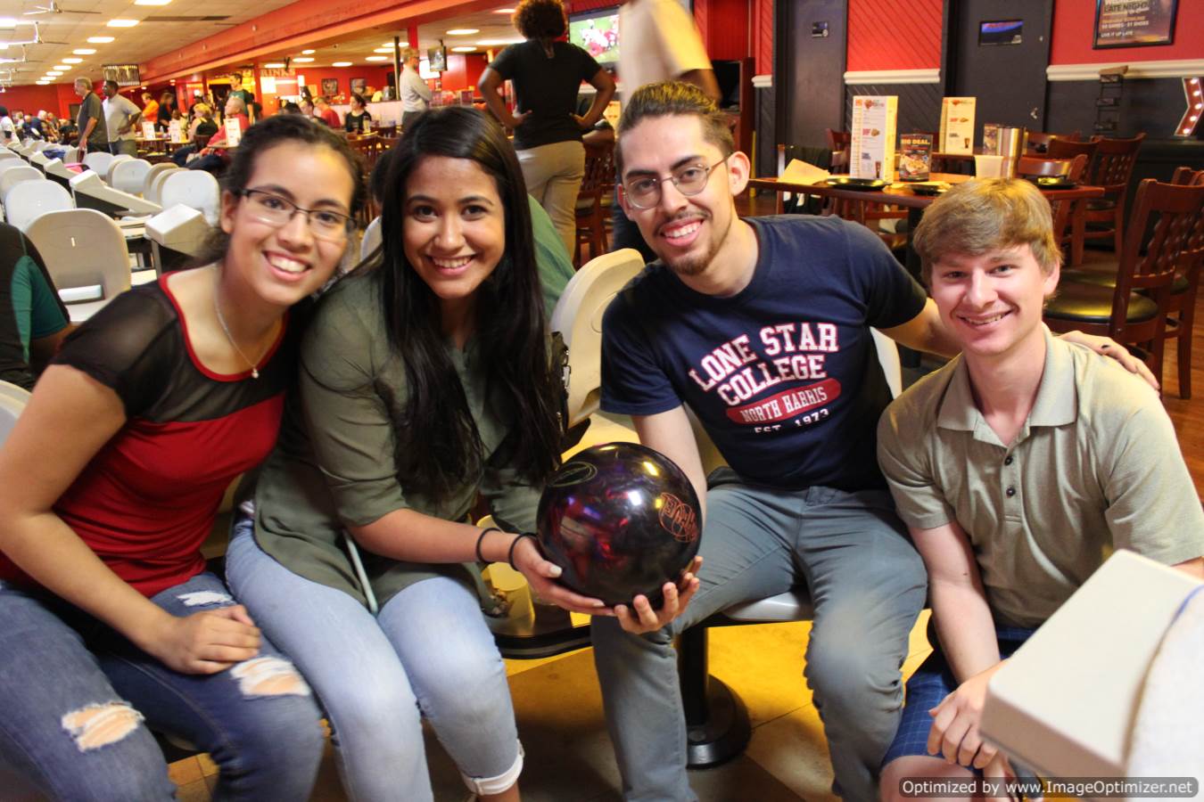 Photo of students at a bowling tournament posing for photo
