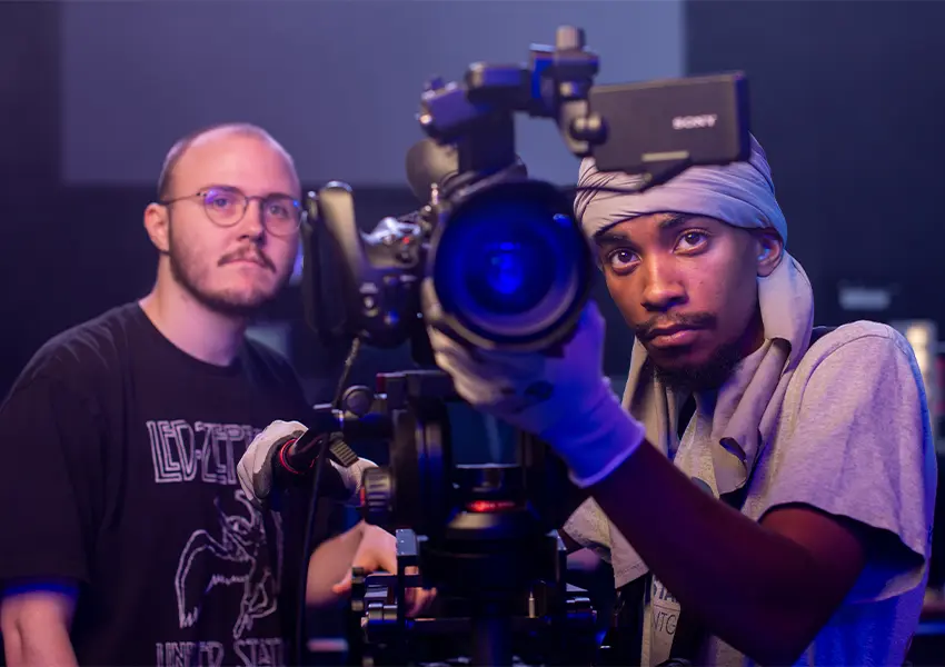A film student works a camera