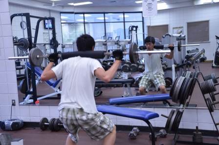 Photo of student working out in the weight room