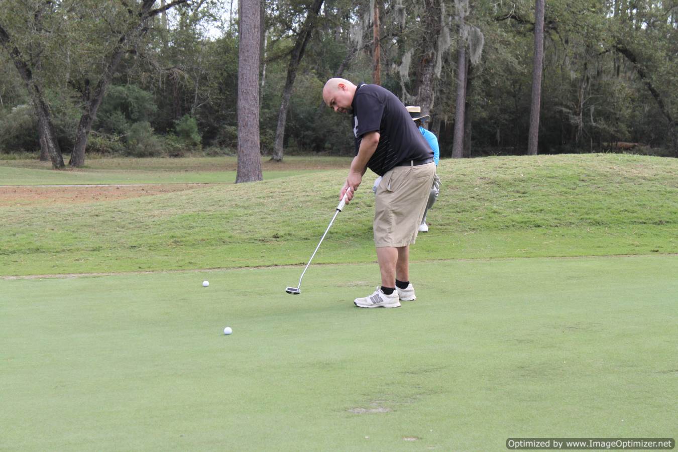 Photo of LSC employee playing golf