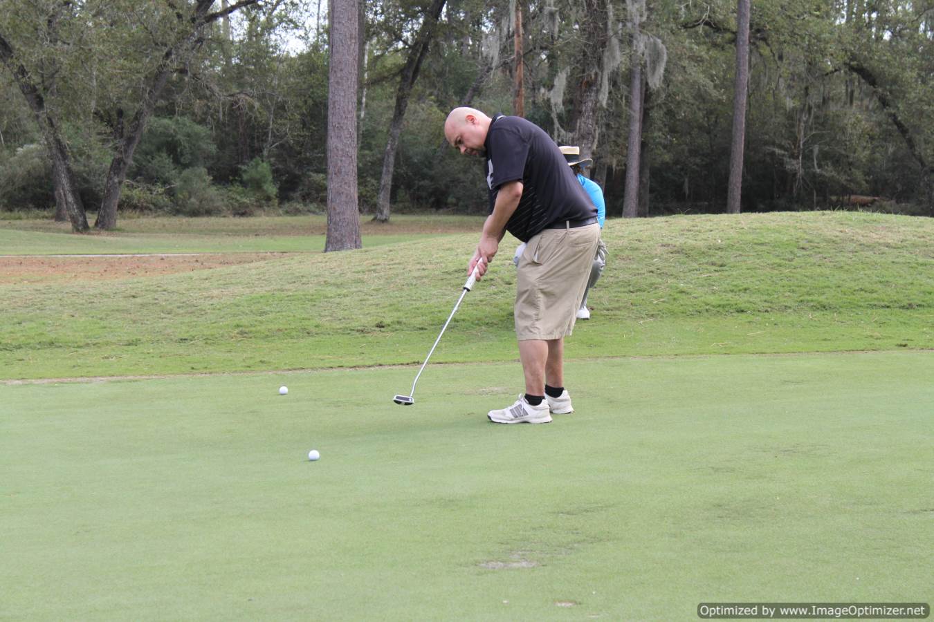 Photo of LSC employee playing golf