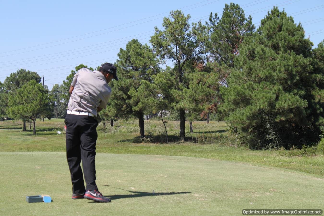 Photo of student playing golf