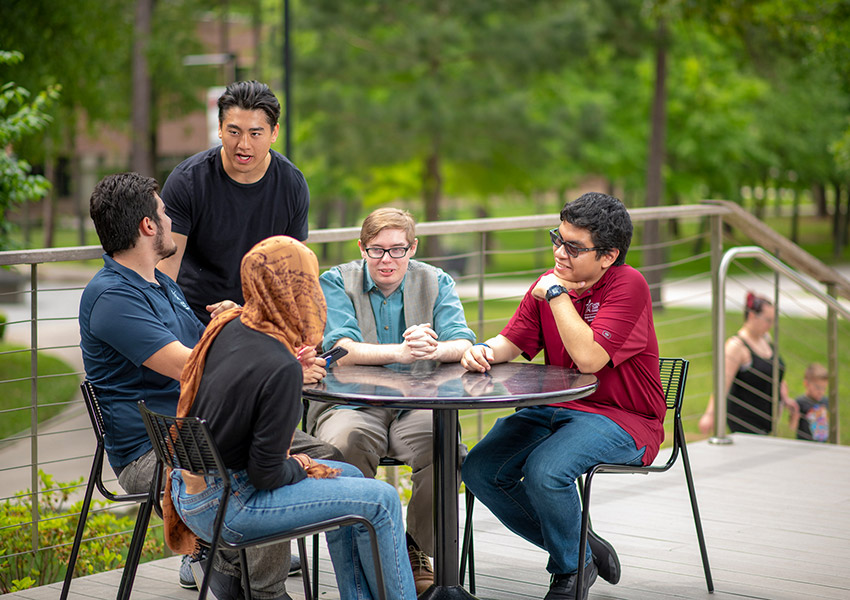 Photo of group of students outside talking