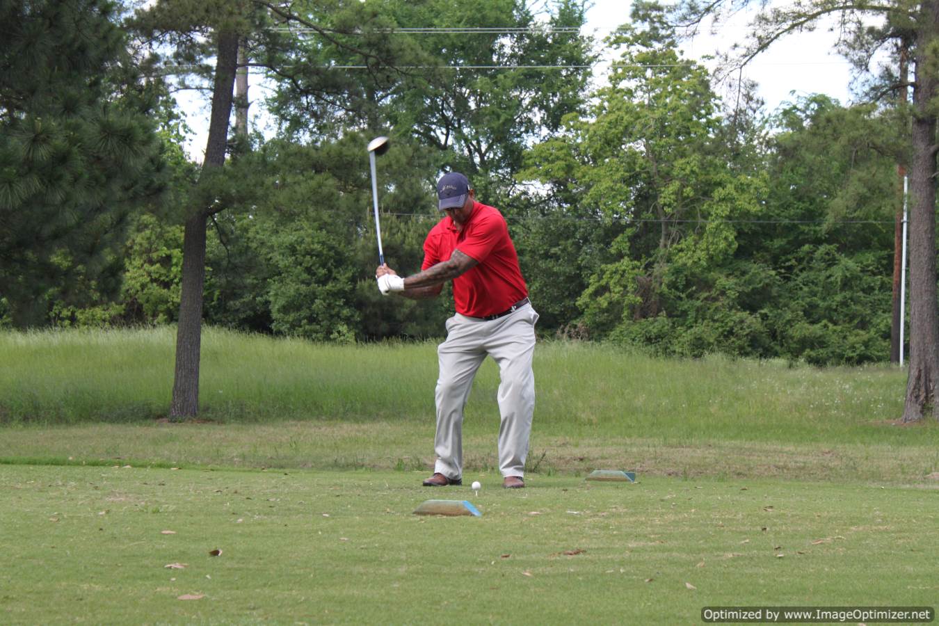 Photo of LSC employee playing golf