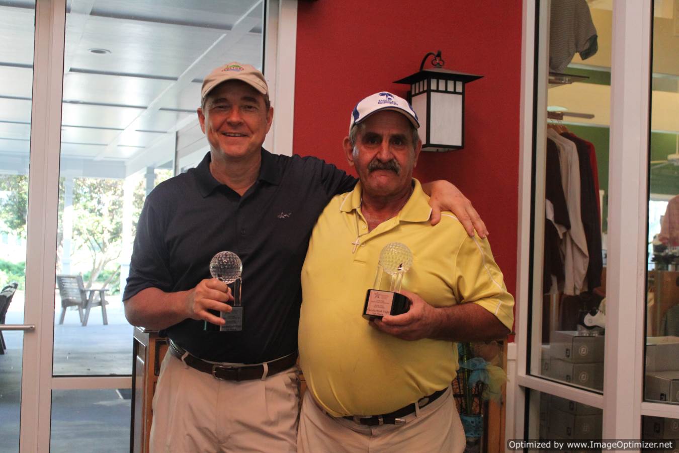 Photo of LSC employees holding a trophy