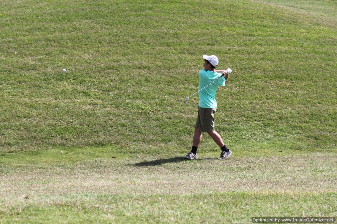 Photo of student playing golf