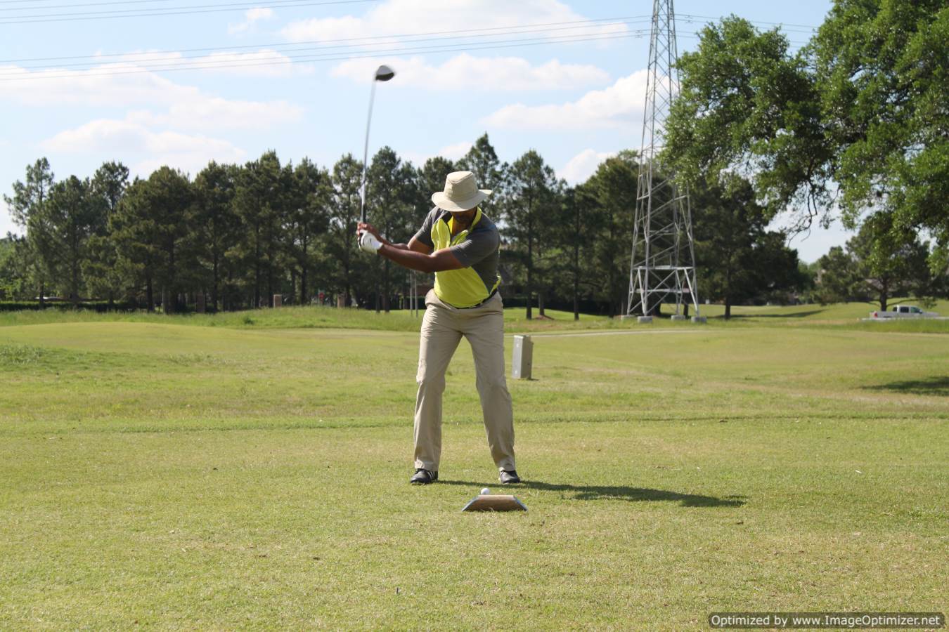 Photo of LSC employee playing golf