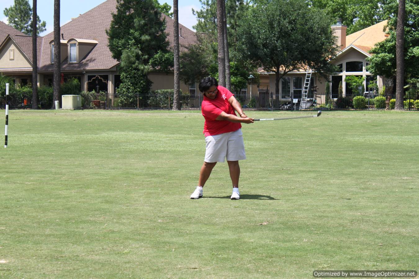 Photo of LSC employee playing golf