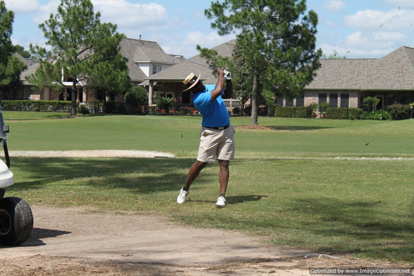 Photo of LSC employee playing golf