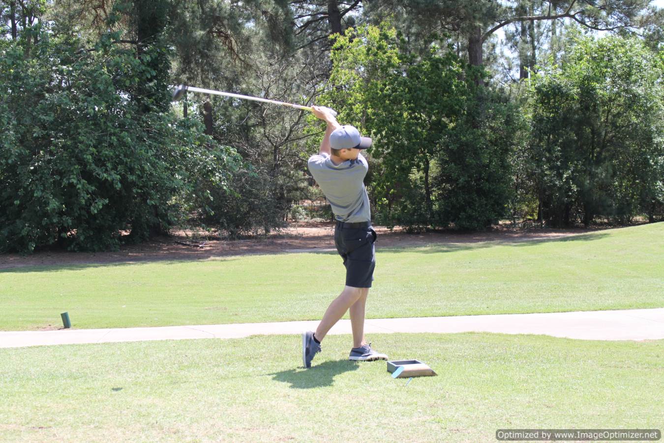 Photo of student playing golf