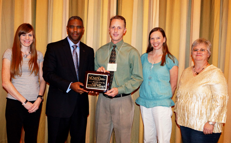 Dr. Austin A. Lane, president of LSC-Montgomery, was recently recognized for his leadership in college marketing and public relations efforts. Pictured with Dr. Lane are member of LSC-Montgomery’s college relations department. (From left to right are Lauren Maddox, writer; Lane; Steve Scheffler, dean of college relations; Brandy Ugent, program coordinator for web content and design; and LaNae Ridgwell, manager of marketing and publications.)
