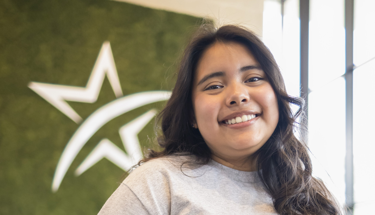 Smiling person registering for college