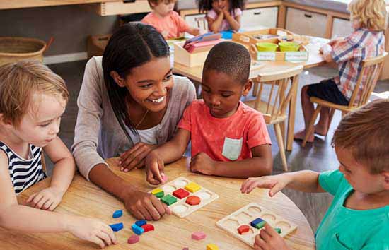 A teacher playing with students