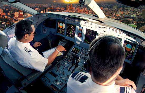 Two pilots sitting in a cockpit