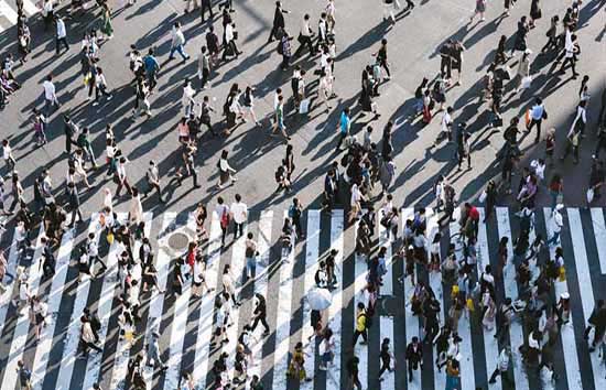 Large crowd of people in a crosswalk