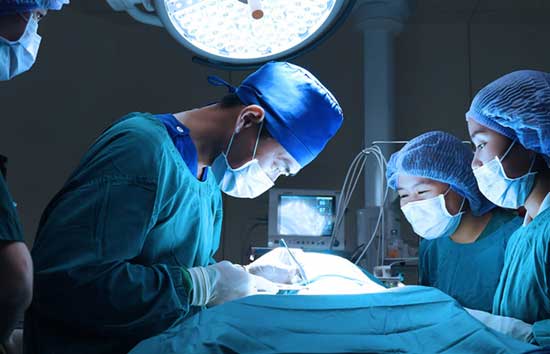 Surgeon operating on a patient