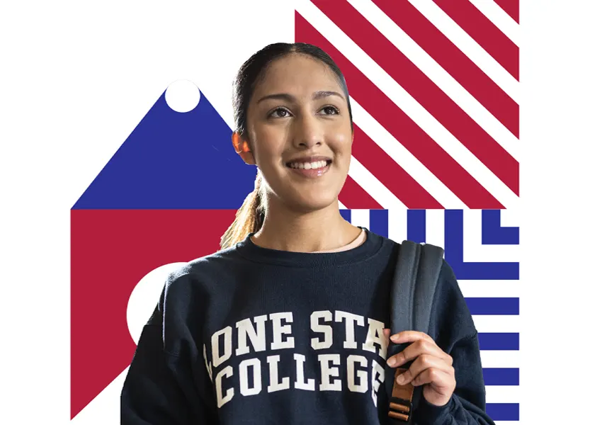  students holding books and smiling