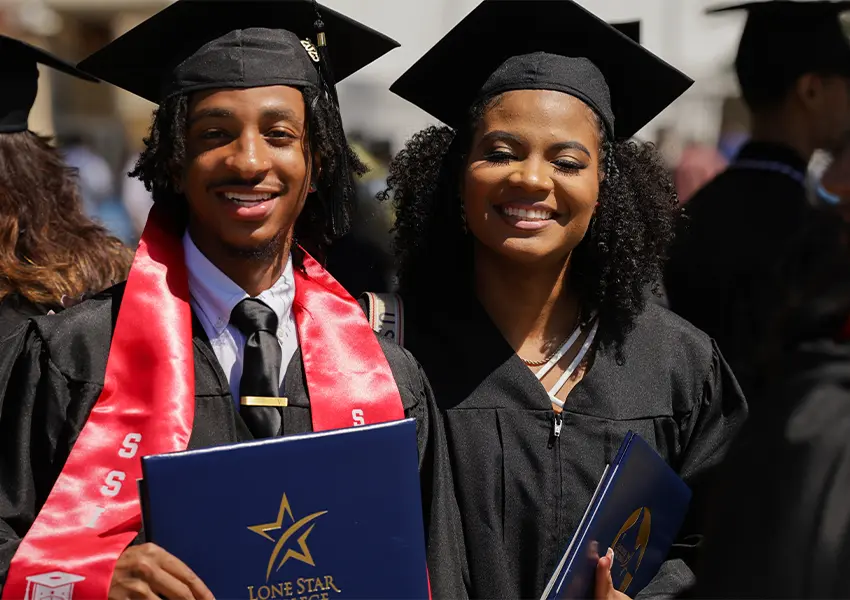 Graduates wearing a grad cap and gown